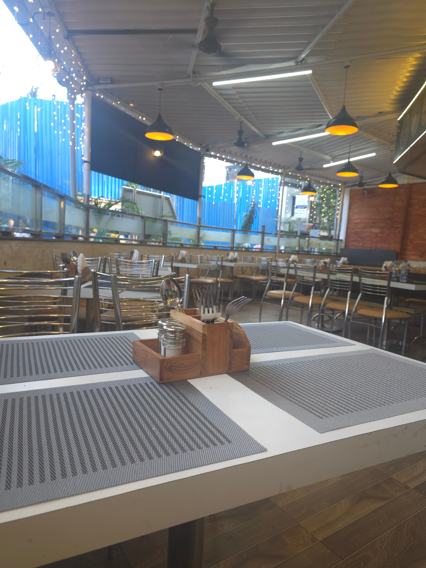Set table with cutlery holder and string-lit ceiling